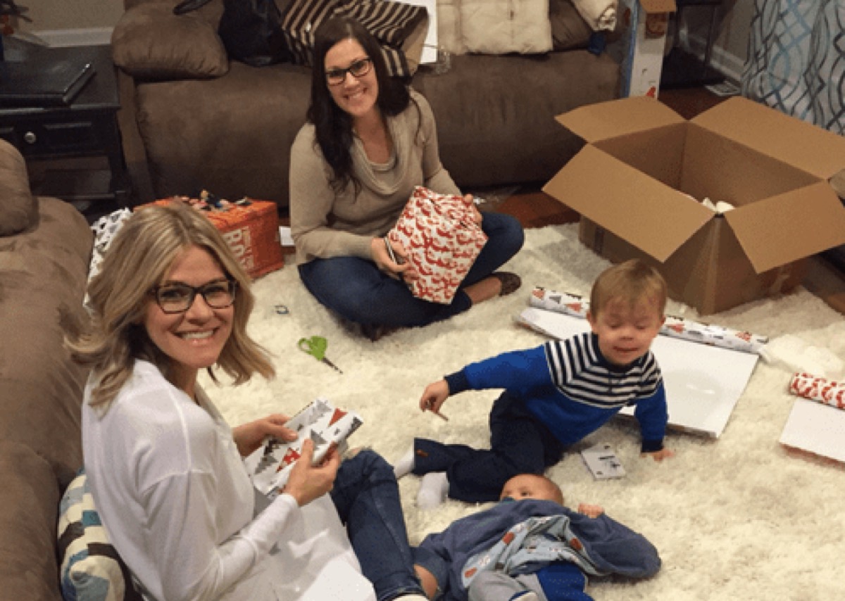 Ken Lear’s family wrapping Christmas presents on the living-room floor